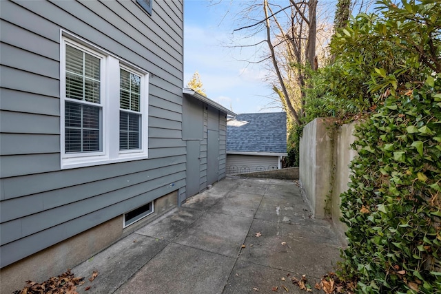 view of side of property featuring a patio