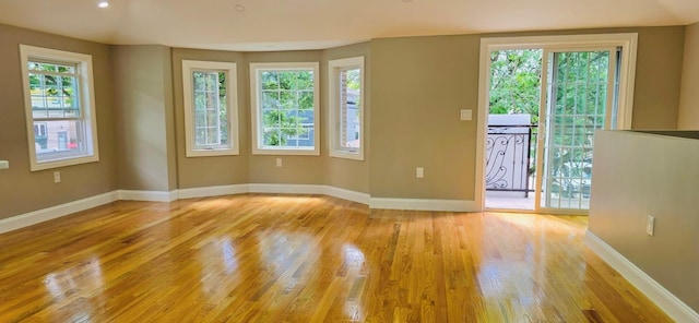 unfurnished room with light hardwood / wood-style flooring