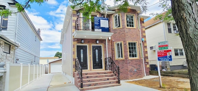 view of front facade featuring a garage and an outdoor structure