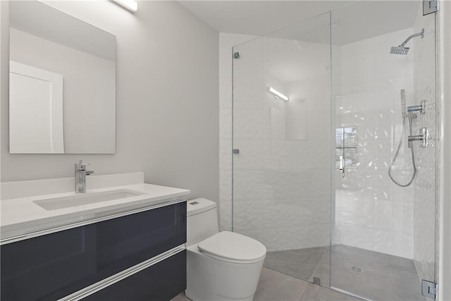 bathroom featuring tile patterned flooring, vanity, toilet, and walk in shower