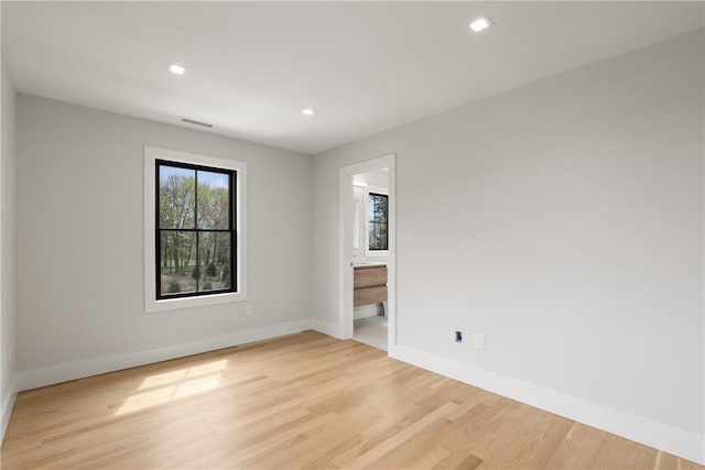 unfurnished room featuring light wood-type flooring