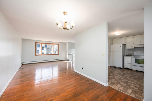 interior space with a chandelier and a baseboard heating unit