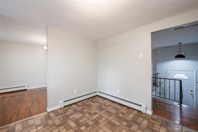 spare room featuring a baseboard radiator