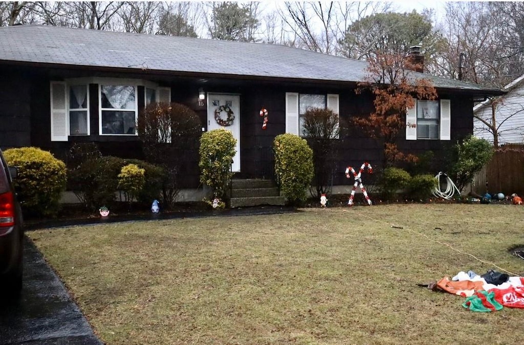 ranch-style house with a front yard