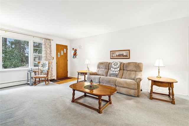 living room featuring carpet and a baseboard heating unit