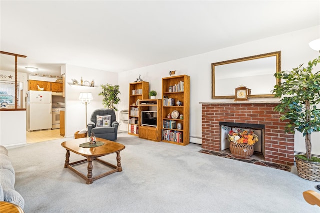 carpeted living room featuring a fireplace and baseboard heating