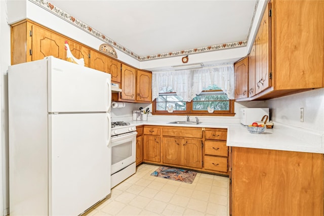 kitchen with sink and white appliances