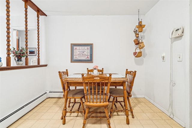 dining room featuring a baseboard heating unit