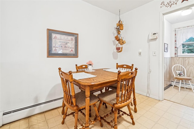 dining area featuring a baseboard heating unit