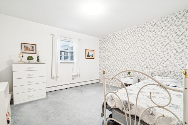 bedroom with light colored carpet and a baseboard heating unit