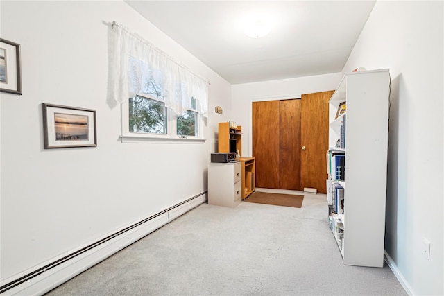 hall with light carpet and a baseboard radiator