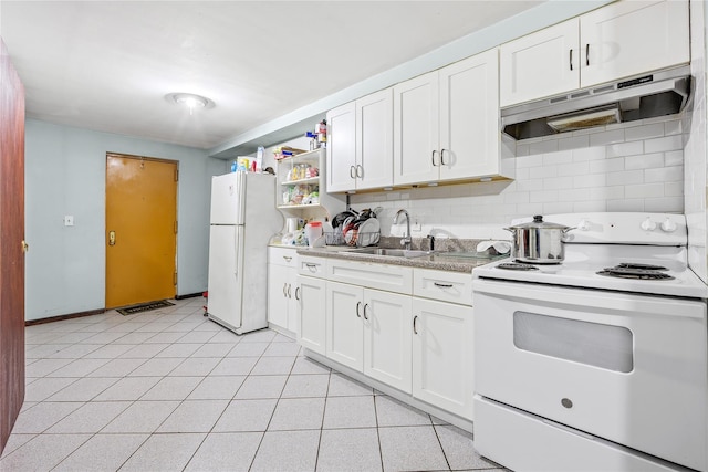 kitchen featuring white appliances, sink, light tile patterned floors, tasteful backsplash, and white cabinetry