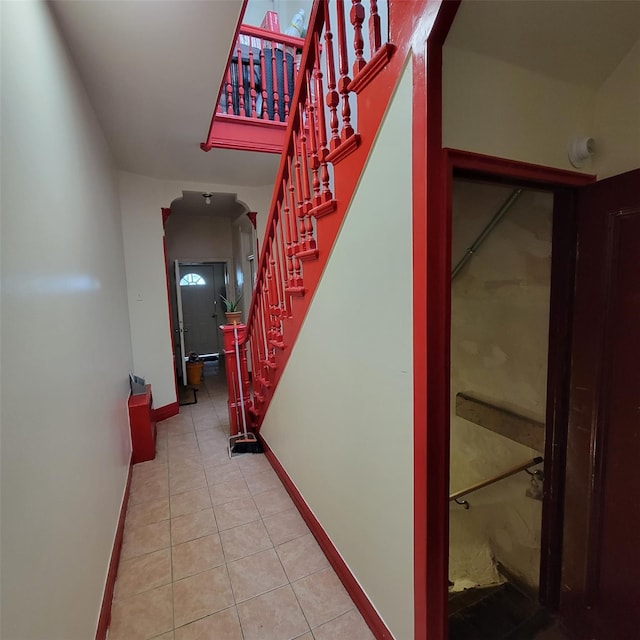 corridor featuring light tile patterned flooring