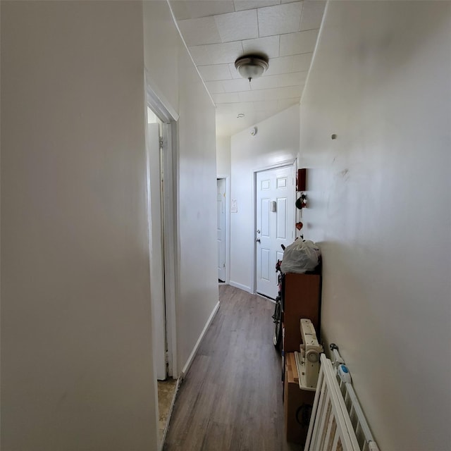 corridor featuring hardwood / wood-style flooring