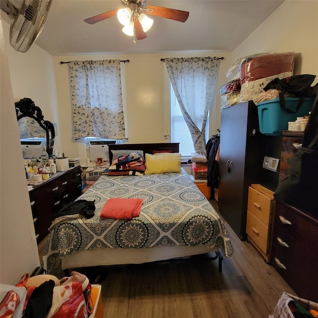 bedroom with hardwood / wood-style floors and ceiling fan