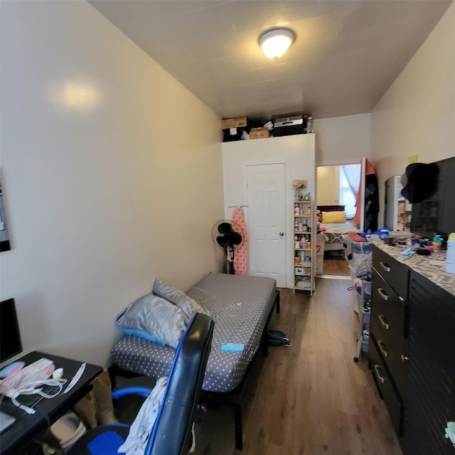 bedroom featuring dark hardwood / wood-style floors