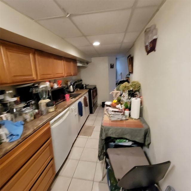 kitchen with a paneled ceiling, electric range, white dishwasher, and light tile patterned floors