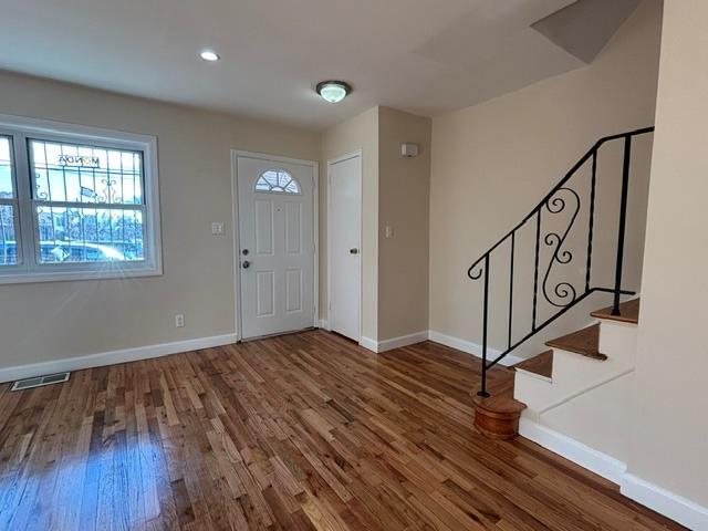 foyer entrance featuring wood-type flooring