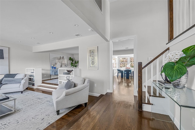 living room with dark wood-type flooring