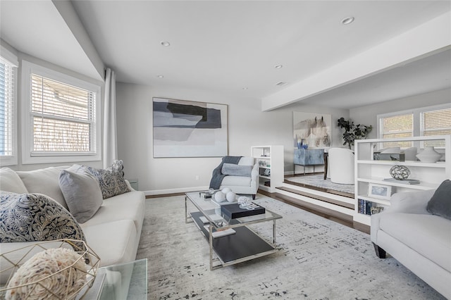 living room featuring hardwood / wood-style floors and beamed ceiling