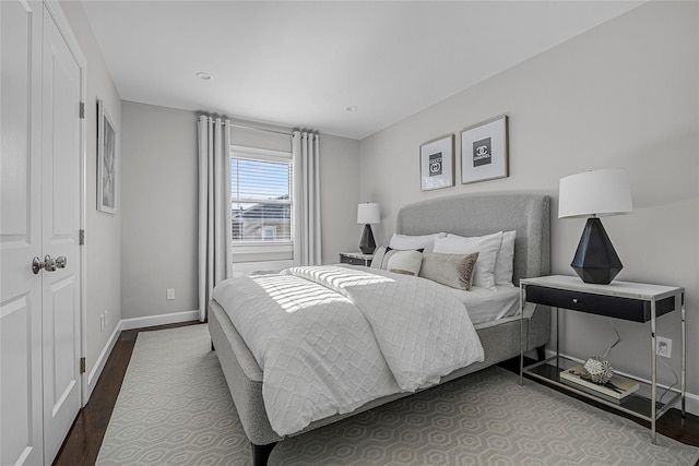 bedroom with hardwood / wood-style flooring and a closet