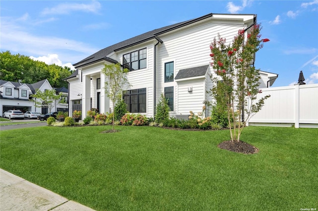 view of front of property with a front lawn