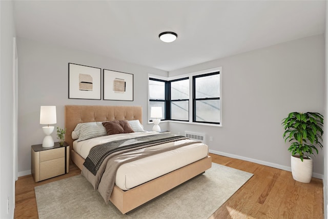 bedroom with light hardwood / wood-style flooring