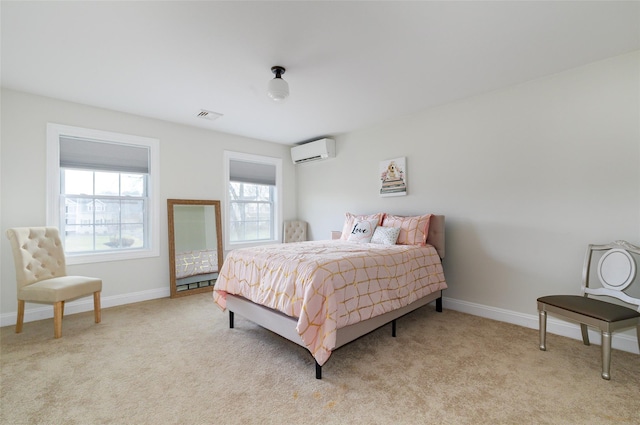 bedroom featuring light carpet and a wall mounted AC