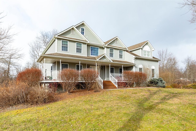 view of front of property featuring covered porch and a front yard