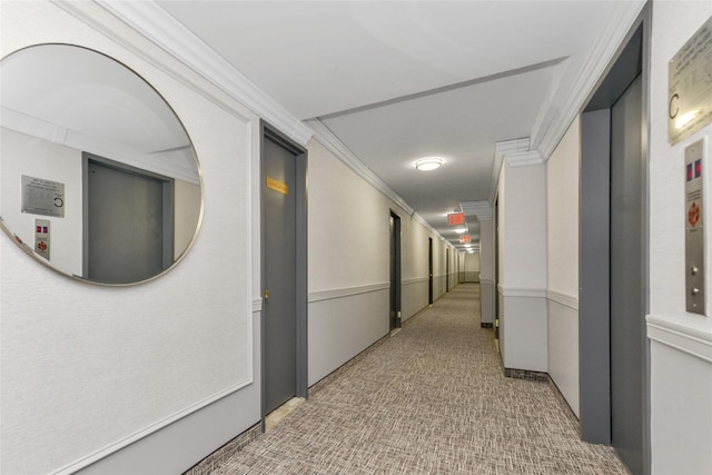 hallway featuring elevator and ornamental molding