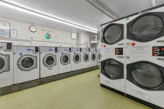 washroom with stacked washer / drying machine and washer and dryer