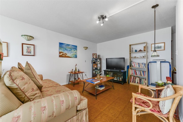 living room with a textured ceiling