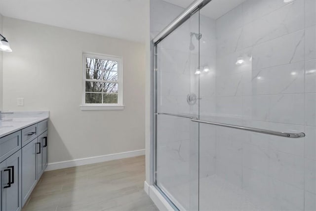 bathroom featuring vanity and an enclosed shower