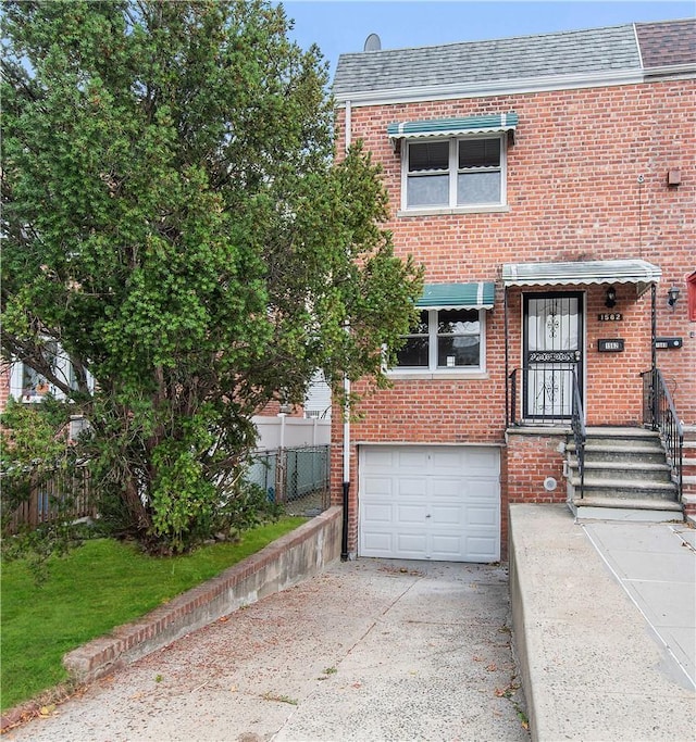 multi unit property featuring a garage