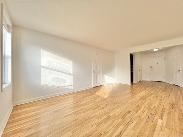 empty room with light wood-type flooring