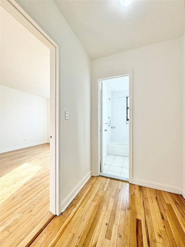 hall with light hardwood / wood-style flooring