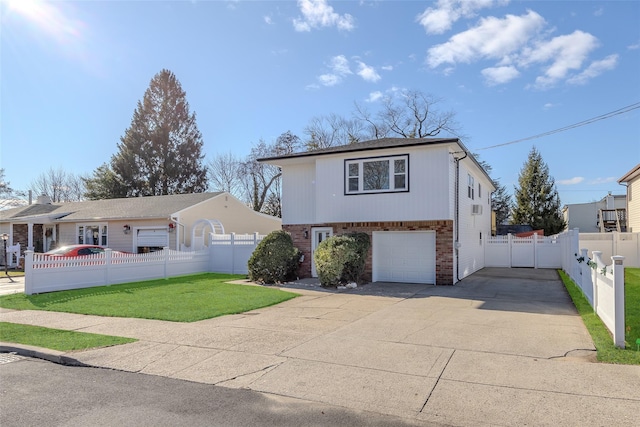 view of front of house featuring a garage and a front lawn