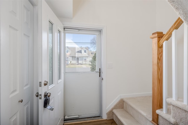 entryway with hardwood / wood-style flooring