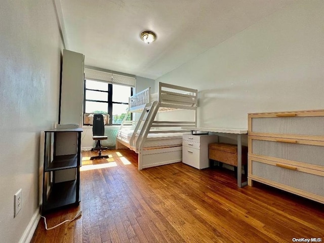 unfurnished bedroom featuring hardwood / wood-style flooring