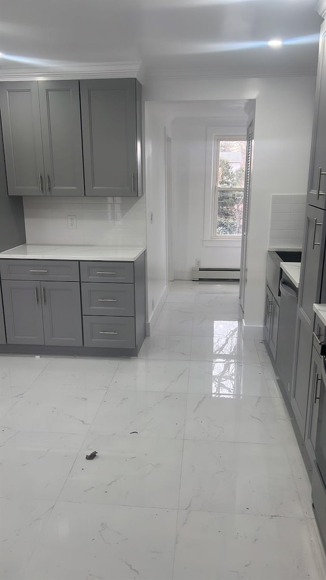 kitchen with baseboard heating and gray cabinetry