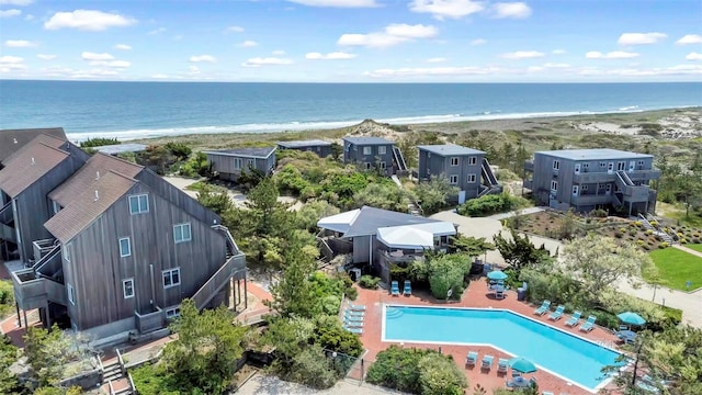 aerial view with a water view and a view of the beach