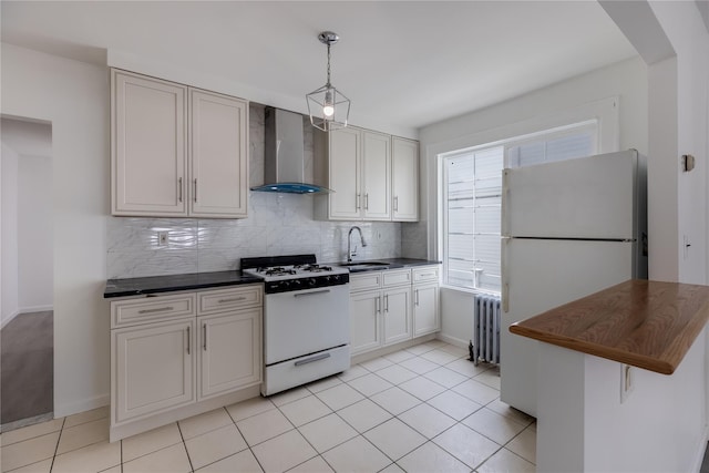 kitchen with radiator heating unit, sink, wall chimney range hood, tasteful backsplash, and white appliances