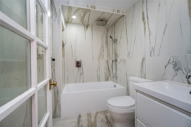 full bathroom featuring bathtub / shower combination, vanity, toilet, and tile walls