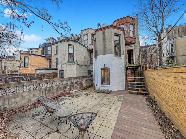 rear view of house featuring a patio