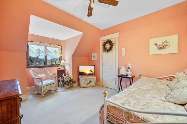 bedroom with carpet flooring, ceiling fan, and vaulted ceiling