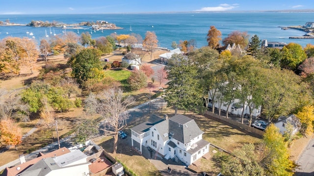 birds eye view of property with a water view