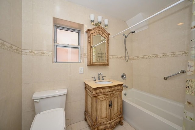 full bathroom with vanity, toilet, tile walls, and shower / tub combo with curtain