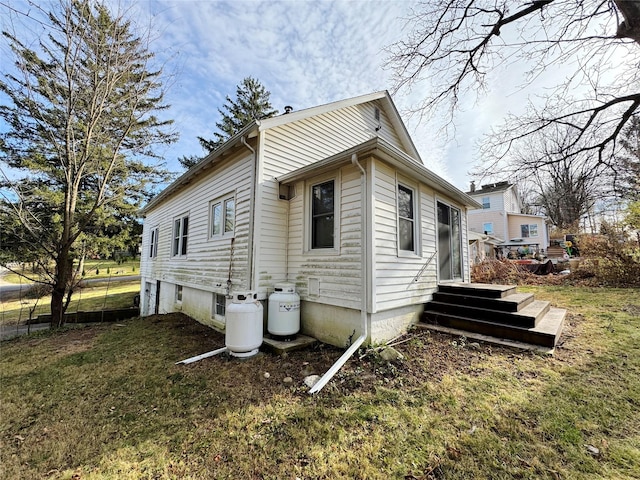 view of home's exterior featuring a yard