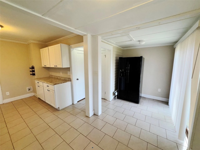 kitchen with white cabinetry, light stone counters, crown molding, black fridge with ice dispenser, and light tile patterned flooring