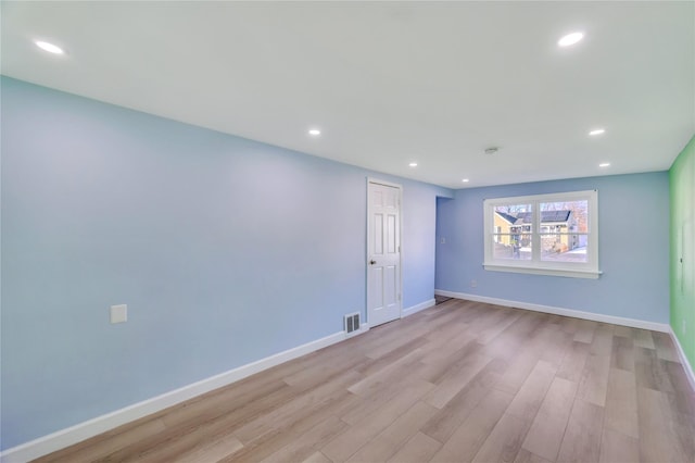 spare room featuring light wood-type flooring